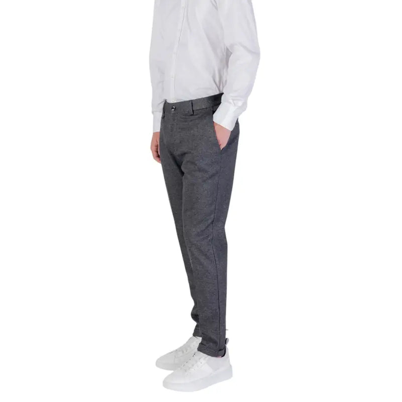 Man wearing Antony Morato Grey Zip Button Fall Winter Men Trousers with white sneakers