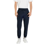 Men’s navy blue joggers with drawstring waist and white sneakers displayed with Antony Morato trousers