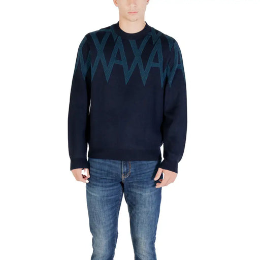 Navy blue sweater with teal zigzag pattern, likely made of cotton or polyester blend.