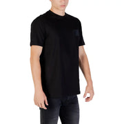 Men’s black cotton short sleeve round neck T shirt with chest pocket and dark jeans