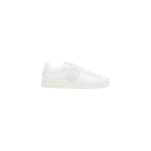 White leather low-top sneaker with lace-up design and chunky sole.