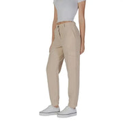 Beige high-waisted pleated trousers with pockets and white sneakers by B.young