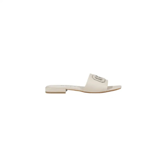 Beige slide sandal with logo showcasing a stylish casual footwear option