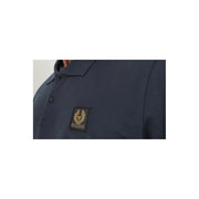 Navy blue polo shirt with gold logo and text, textured fabric.