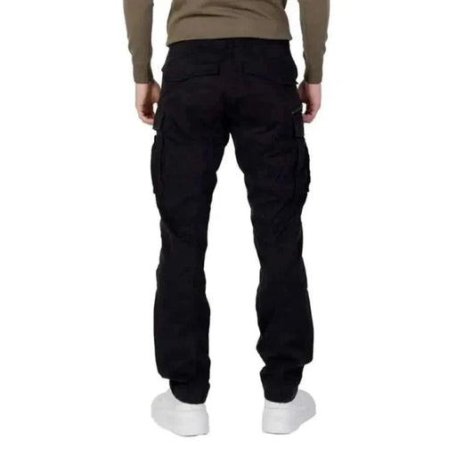 Black cargo pants viewed from behind, featuring Replay branding for men