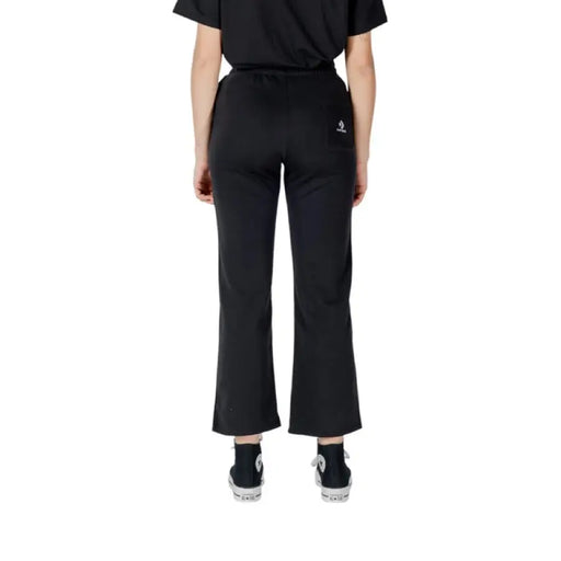 Black Cropped Flare Pants displayed with stylish Black Converse footwear