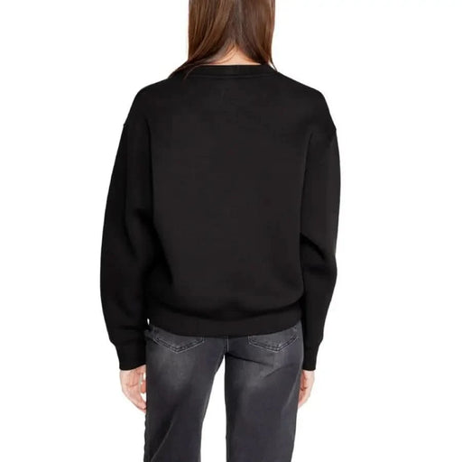 Black crewneck sweatshirt displayed from the back for Guess Active Women’s collection