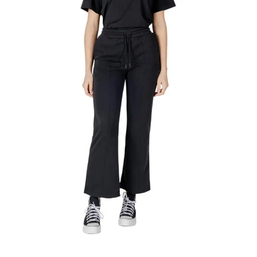 Black Cropped Flare Pants showcased in a stylish setting for contemporary fashion