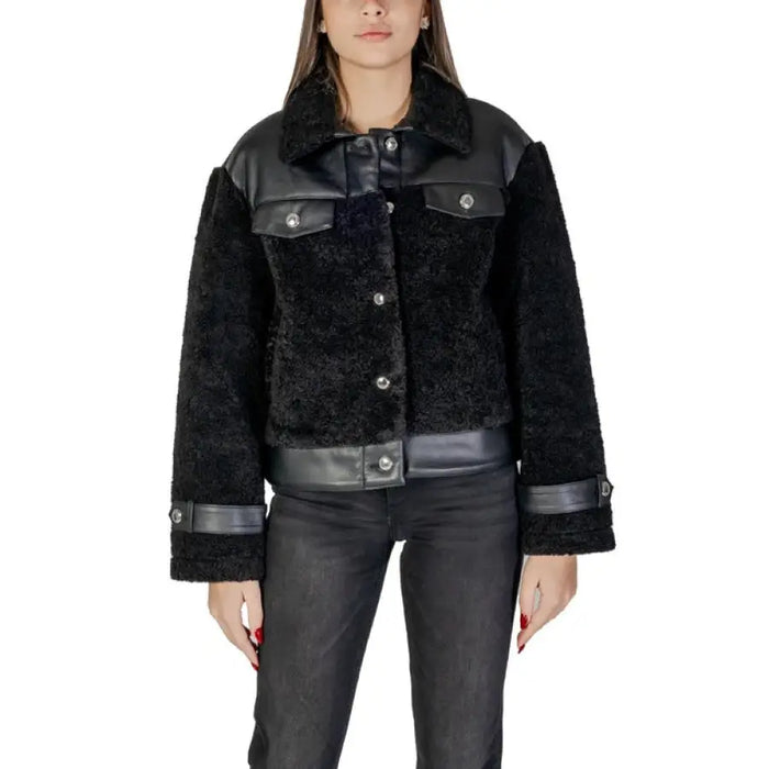 Black faux fur jacket with leather accents showcasing a stylish and luxurious outerwear piece
