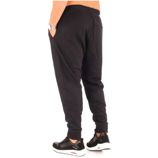 Nike Men All Seasons Trousers in Black showcasing stylish black jogger pants