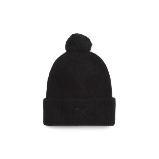 Black knit beanie with pompom for cozy winter style from Black Knit Beanie With Pompom collection