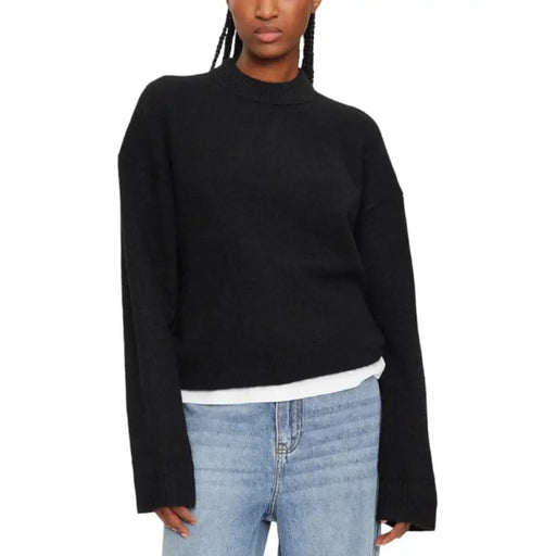 Black oversized knit sweater for women, stylish and comfortable winter apparel piece