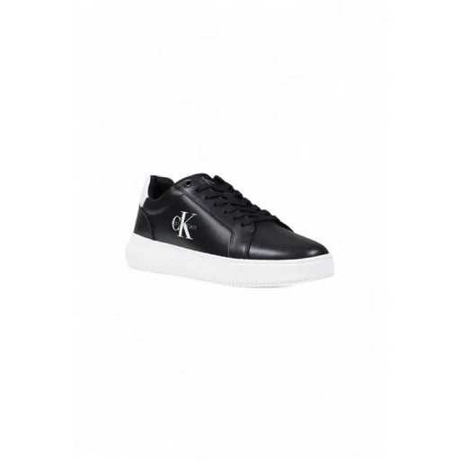 Black leather Calvin Klein sneaker with white sole displayed in product image