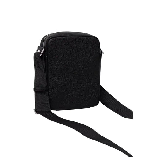 Black leather crossbody bag by Tommy Hilfiger with adjustable strap and sleek design