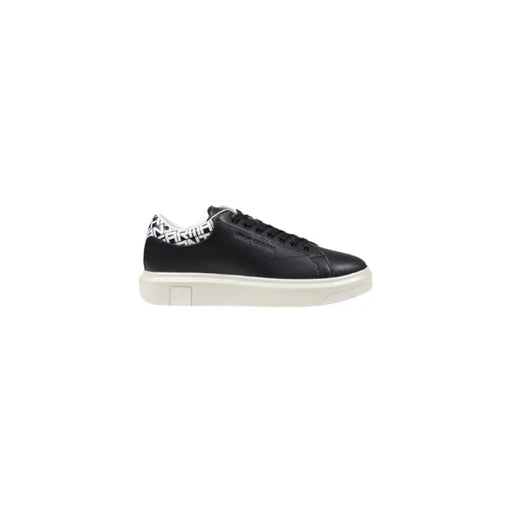 Black leather sneaker with white sole and patterned heel for stylish comfort