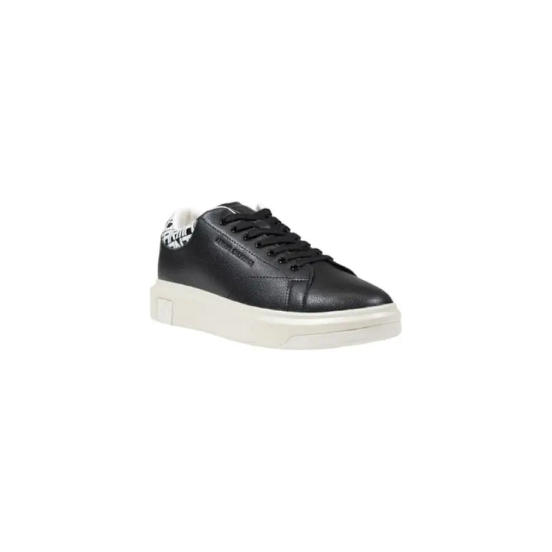 Black leather sneaker with patterned heel and white sole for stylish comfort