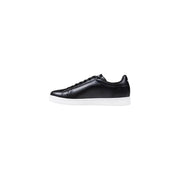 Black leather sneaker with white sole showcasing stylish athletic footwear