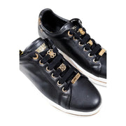 Guess black women fall winter polyurethane lace-up sneakers with black leather, gold eyelets, and decorative charms
