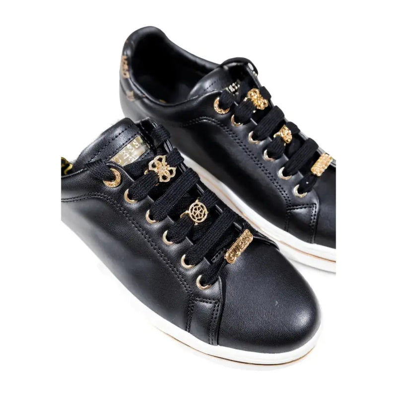 Guess black women fall winter polyurethane lace-up sneakers with black leather, gold eyelets, and decorative charms