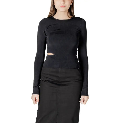 Black long-sleeve cutout top and coordinating skirt in the Black Long Sleeve Cutout Ensemble