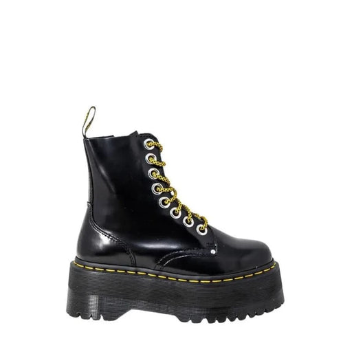 Black platform combat boots by Dr. Martens featuring a lace-up design for women