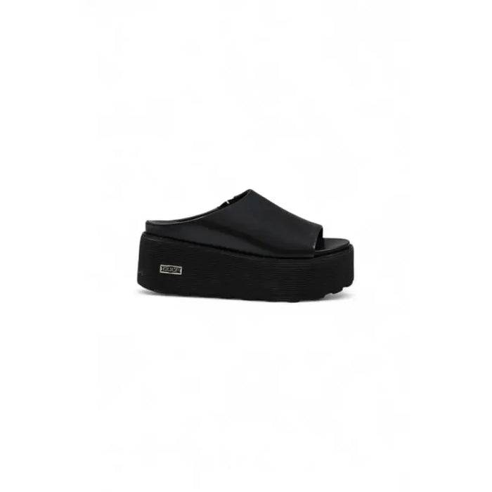 Black platform sandal showcasing stylish designer footwear for women