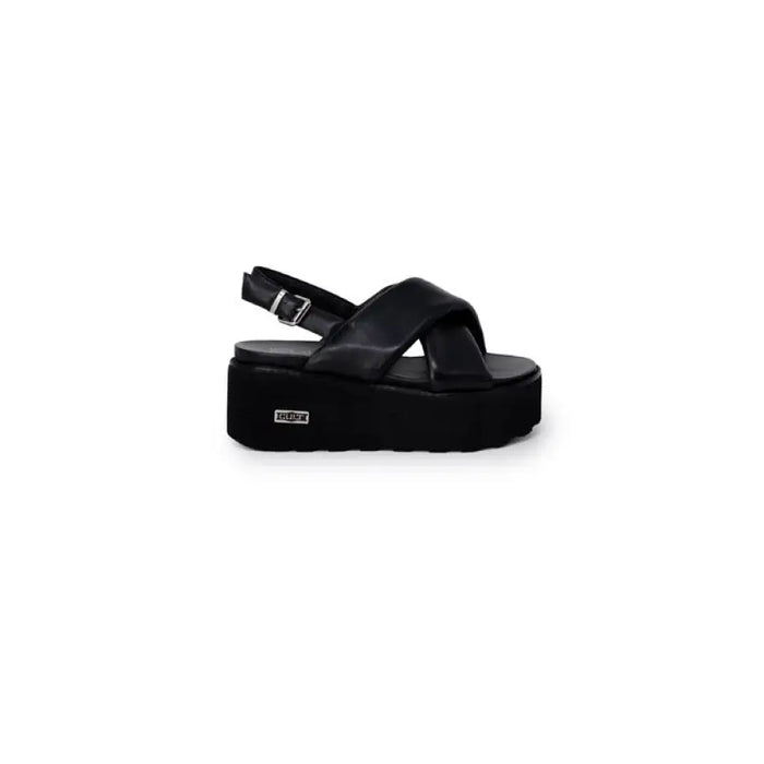 Black platform sandal displayed in a product image showcasing stylish footwear