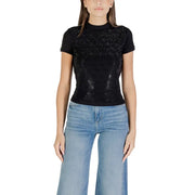 Guess Women Black Short Turtleneck T Shirt paired with light blue wide-leg jeans