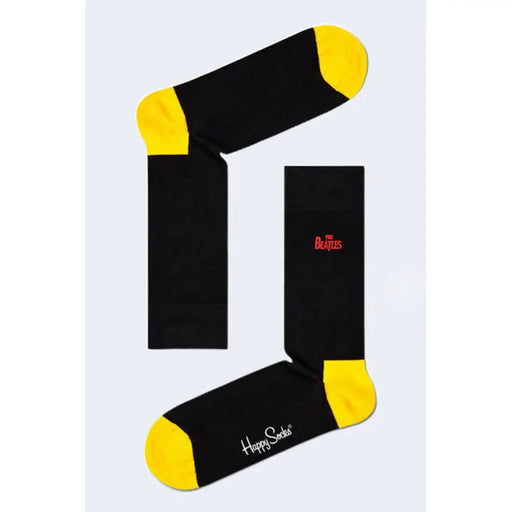 Black socks with yellow toes and heels featuring the Beatles logo for stylish wear