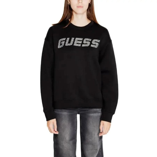 Black sweatshirt featuring sparkly silver GUESS logo across the chest for women