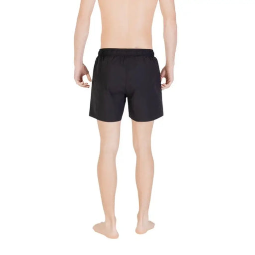 Black swim trunks displayed for men’s swimming and beachwear fashion