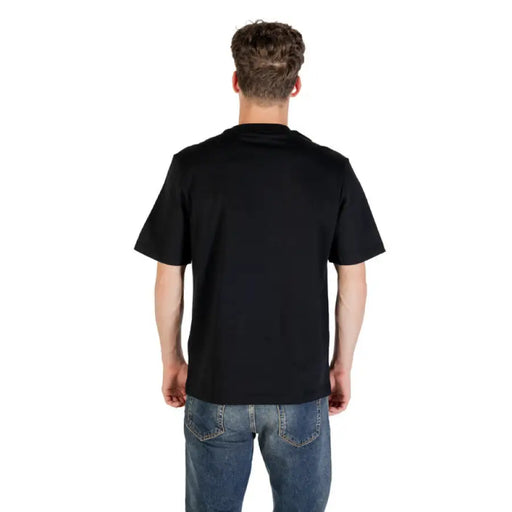Black T-Shirt with Zippered Pocket paired with Blue Jeans displayed clearly