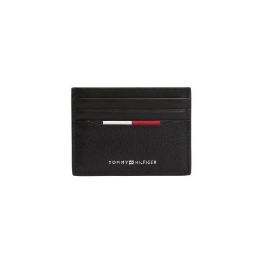 Black Tommy Hilfiger leather card holder displayed for purchase