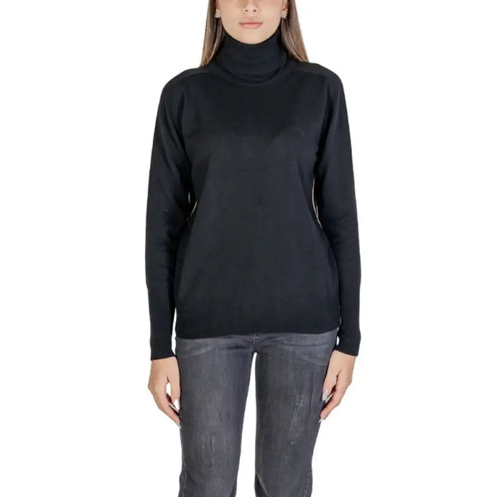 Black turtleneck sweater with side zippers displayed for fashion and style