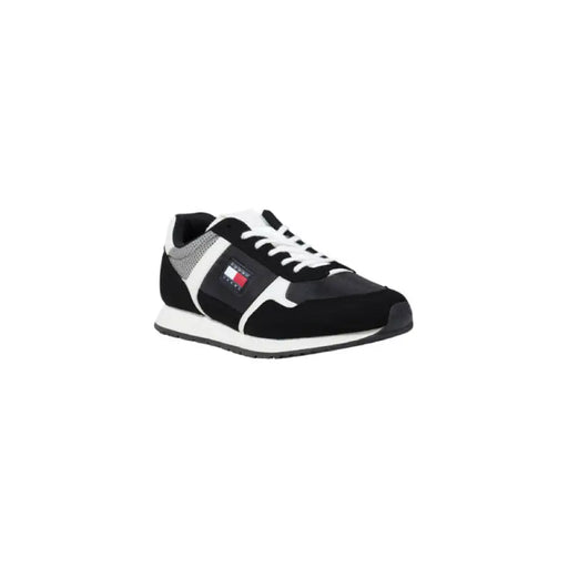 Black and white Tommy Hilfiger sneaker displayed in the product listing