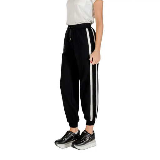 Black women’s track pants with white side stripes from Liu Jo featuring lace details