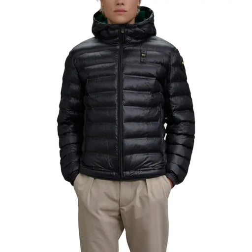 Black quilted down jacket with hood and zipper closure.