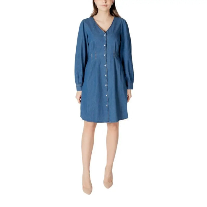 Blue long sleeve denim dress with button-down design displayed in product image