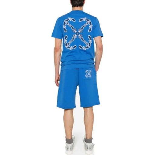 Blue short-sleeved t-shirt and shorts set displayed for casual wear over a white background