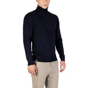 Navy blue turtleneck sweater with ribbed cuffs and hem, made of soft wool