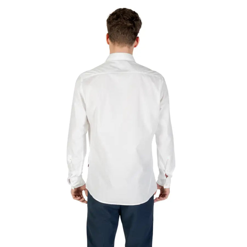 Men’s classic white cotton long-sleeved dress shirt with dark trousers for formal wear