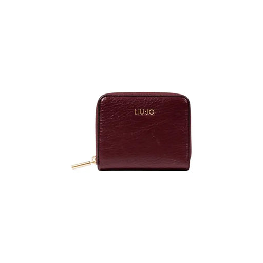Burgundy shiny leather wallet with zipper closure for secure storage