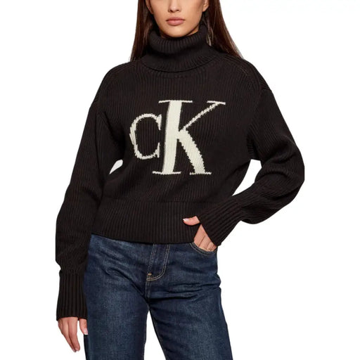 Women’s black Calvin Klein turtleneck sweater with white CK logo for women