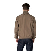 Men’s brown bomber jacket and dark blue jeans displayed with Calvin Klein Jeans Green Zip Front Long Blazer