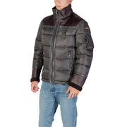 Black and brown quilted puffer jacket with fur-lined hood, likely from a popular outdoor brand.