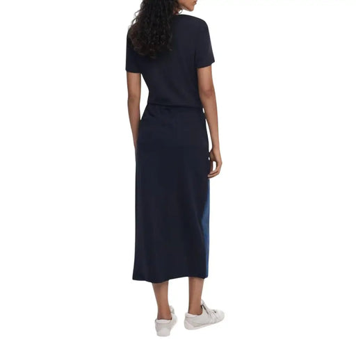 Woman wearing a dark blue short-sleeve midi dress with drawstring waist for Desigual Blue Cotton Elastane collection
