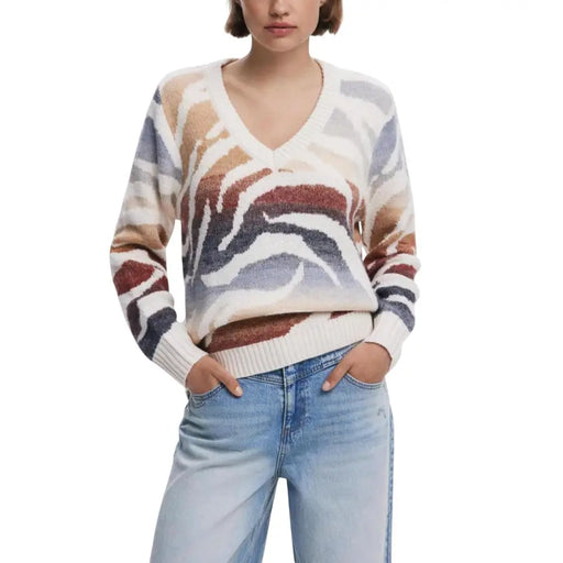 Women’s V-neck sweater with abstract zebra print in white, blue, brown, and black