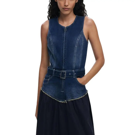 Dark blue sleeveless denim top with front zipper, belted waist, and asymmetrical frayed hem