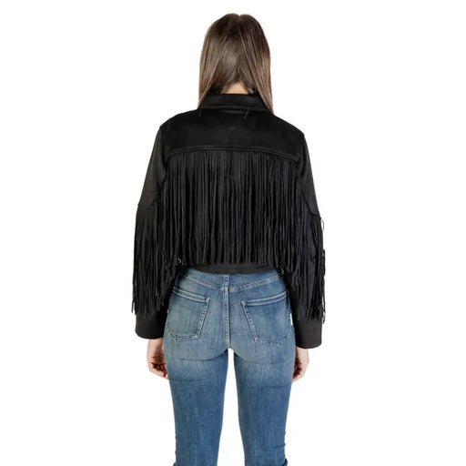 Elegant black fall winter blazer for women featuring a fringed cropped jacket and blue jeans