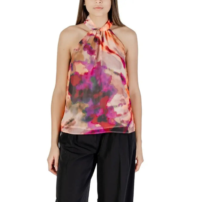 Floral halter top paired with stylish black pants displayed in the product listing
